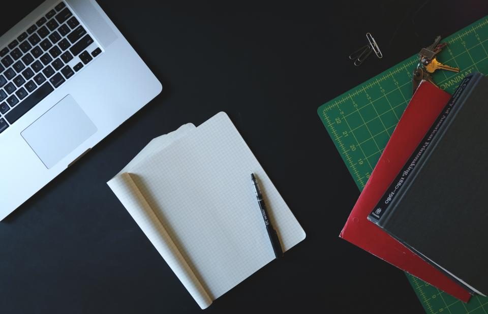 Notebook and planning materials on a desk